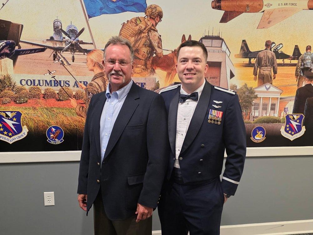 Scott with his son at Columbus Air Force Base